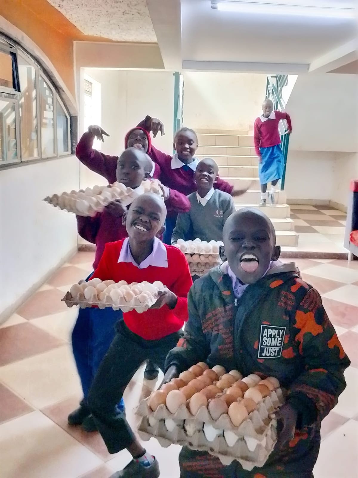 Children with eggs from the centre's poultry project